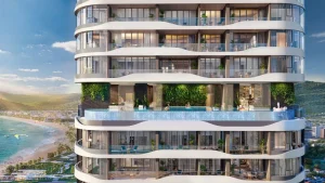 Cận cảnh mặt đứng tháp Q Terra với ban công cong và hồ bơi giữa các tầng
